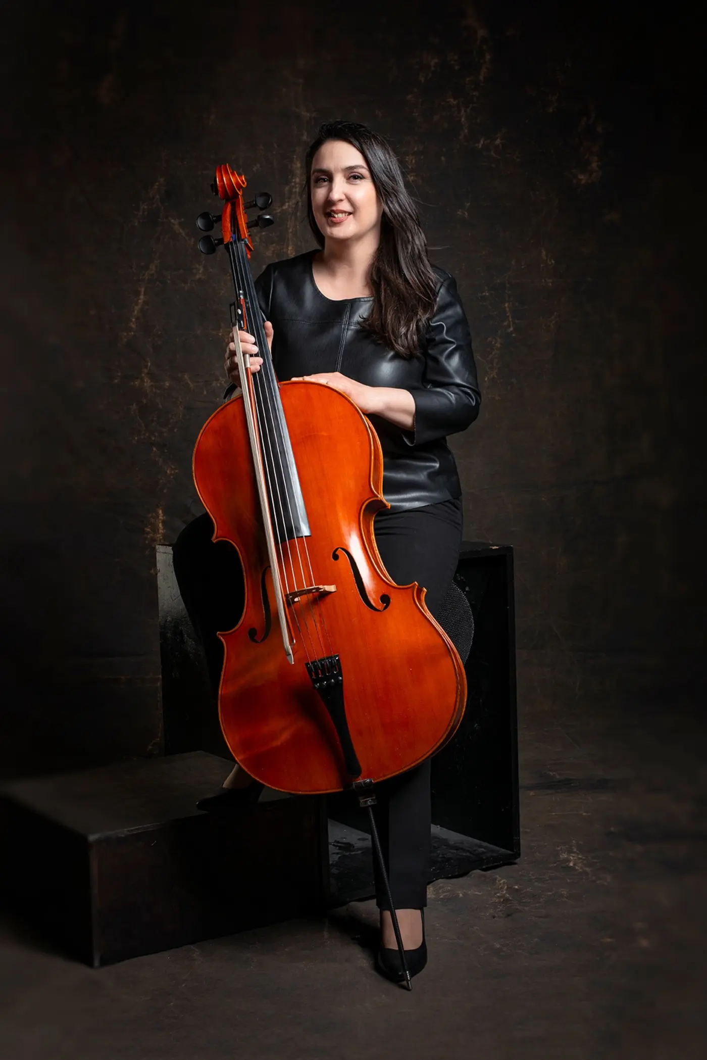 Full-length portrait of Irina with cello